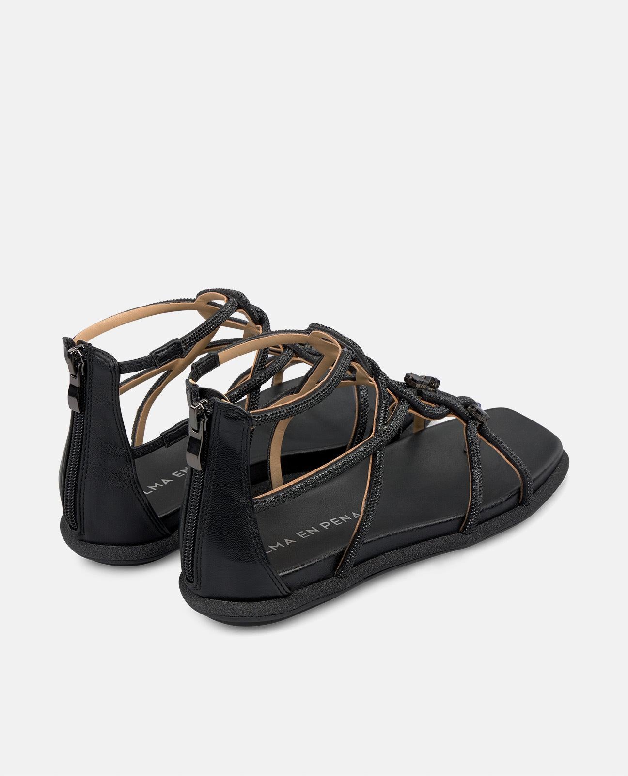 SANDALIA PLANA TIRAS ENREDADAS