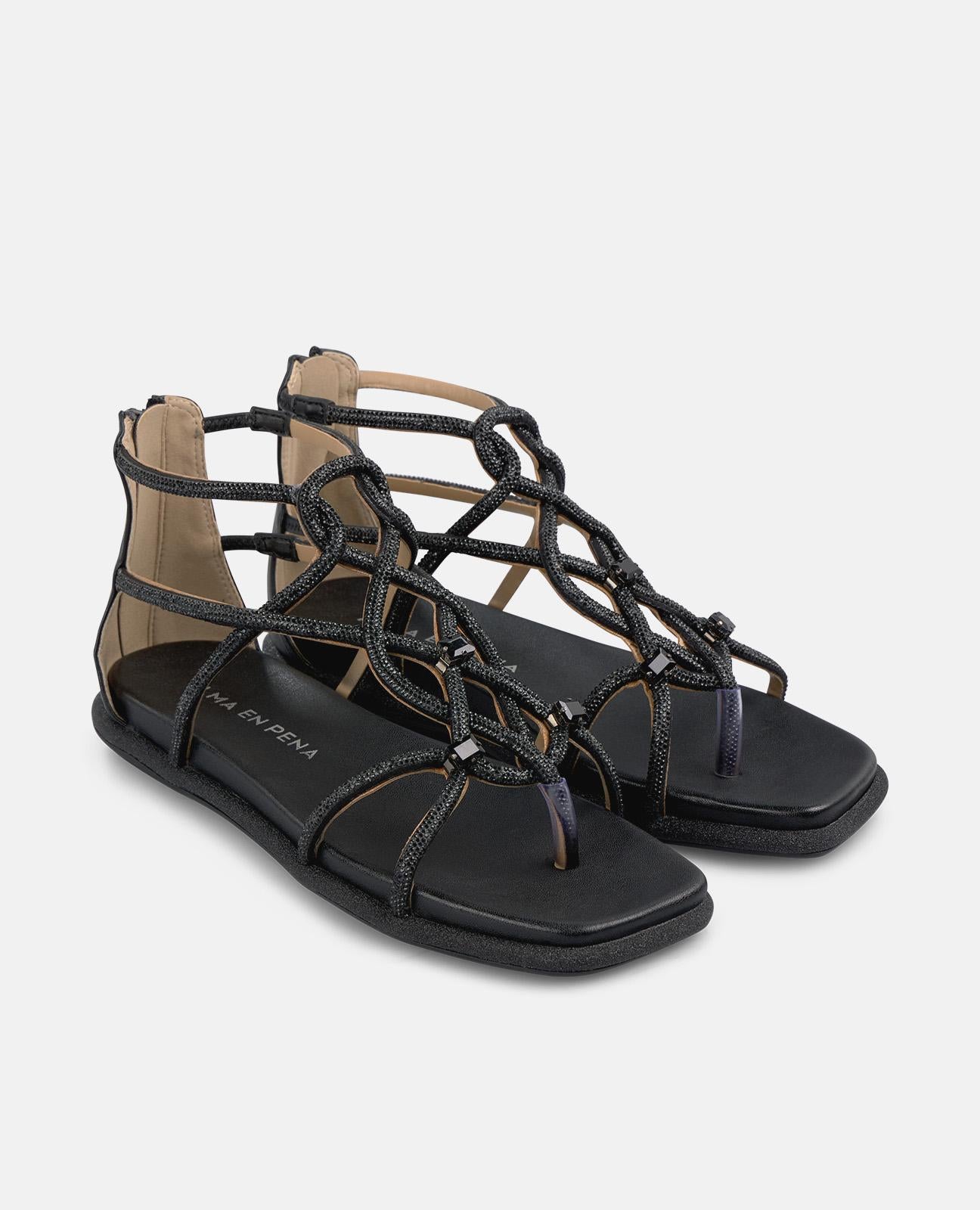 SANDALIA PLANA TIRAS ENREDADAS