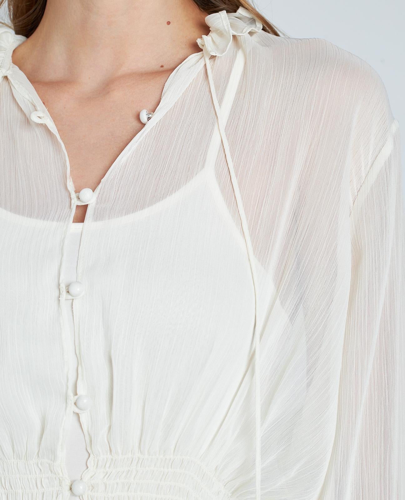 BLUSA SEMITRANSPARENTE VOLANTES