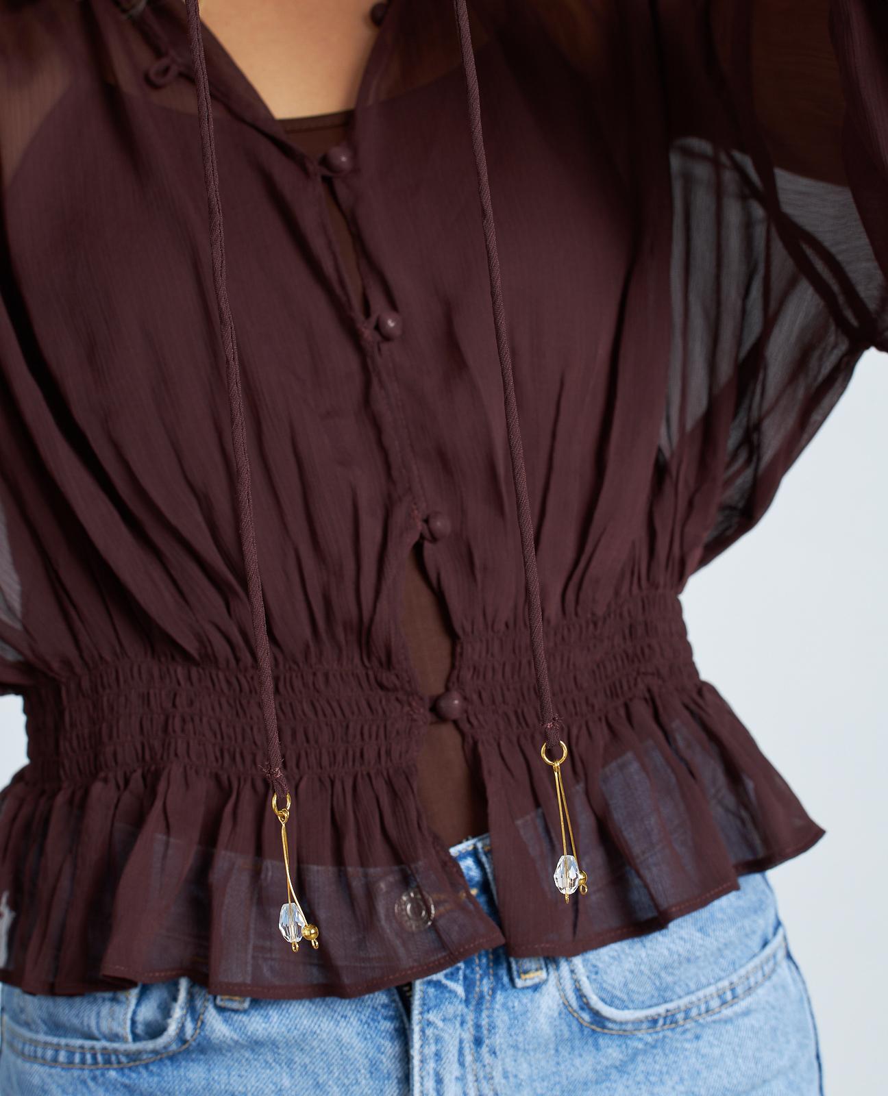 BLUSA SEMITRANSPARENTE VOLANTES