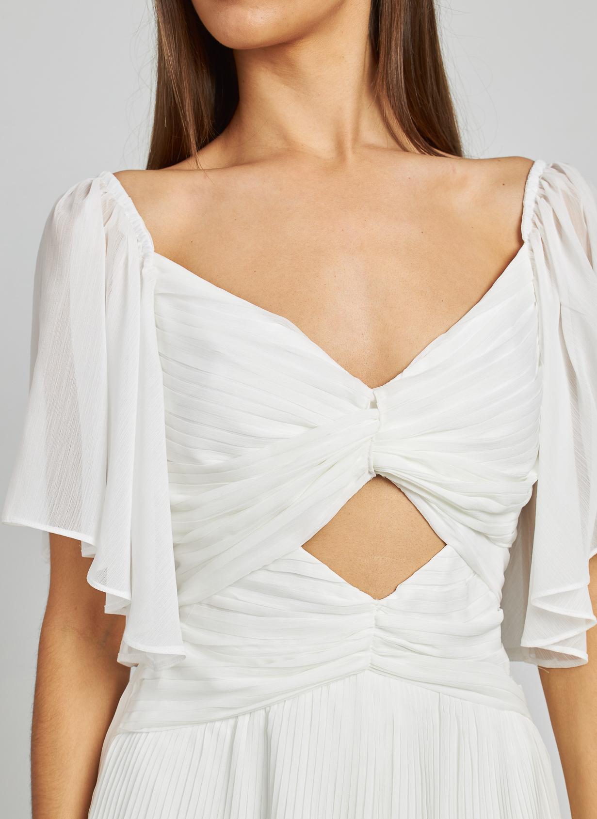 VESTIDO COM FOLHOS RECORTADOS