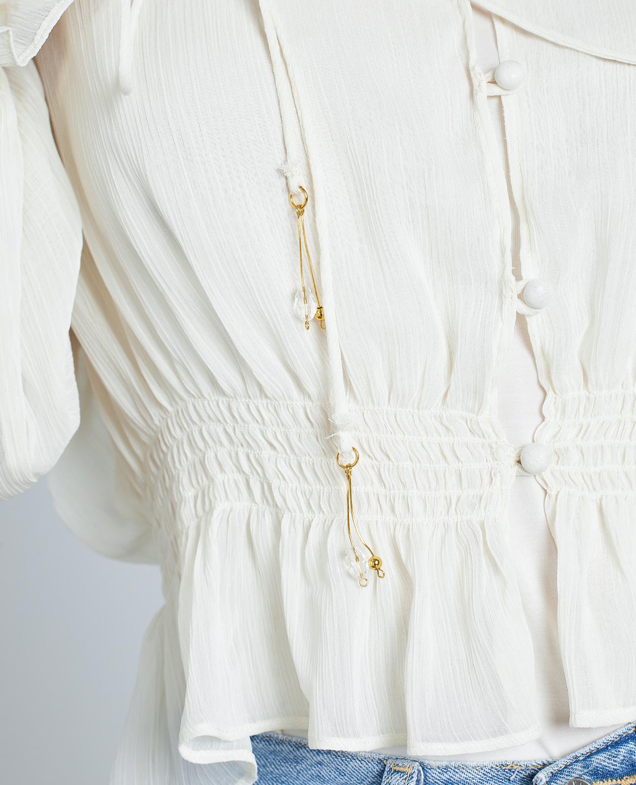 BLUSA SEMITRANSPARENTE VOLANTES